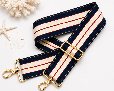 Strapistry Liberty Heritage Strap product spec sheet showing the 2 inch wide woven polyester webbing, adjustable 24-50 inch length, gold-tone hardware, and colorway swatches for crossbody, shoulder, and backpack carry