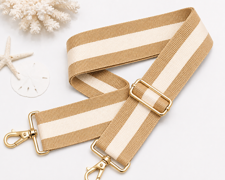 Strapistry Sand Drift Strap product spec sheet showing the 2 inch wide woven polyester webbing, adjustable 24-50 inch length, gold-tone hardware, and colorway swatches for crossbody, shoulder, and backpack carry